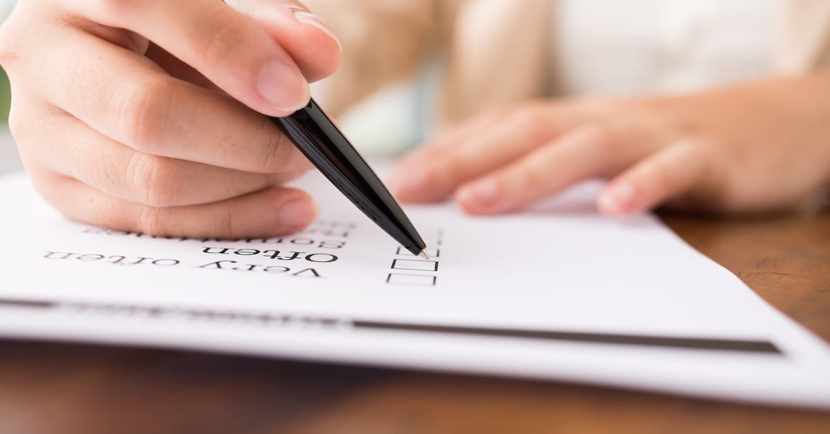 Financial Checklist | Hand checking off a list